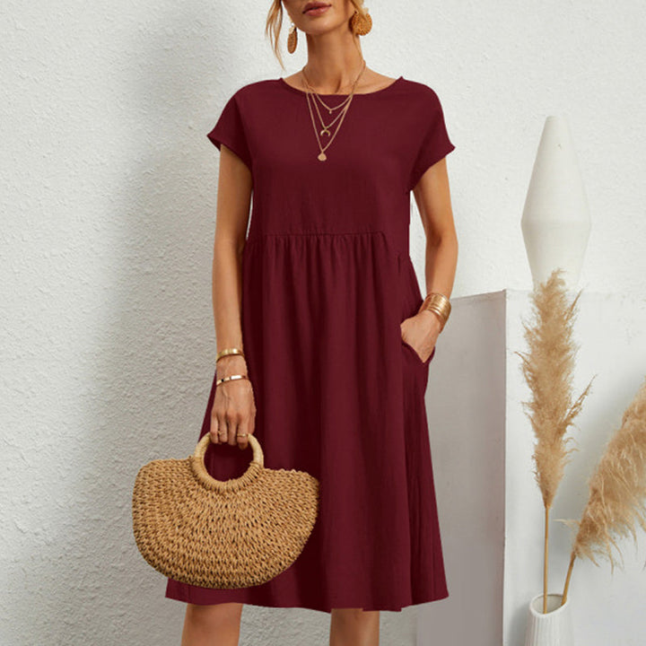 Monochrome round neck midi dress, a versatile cotton essential for women's casual wardrobe.
