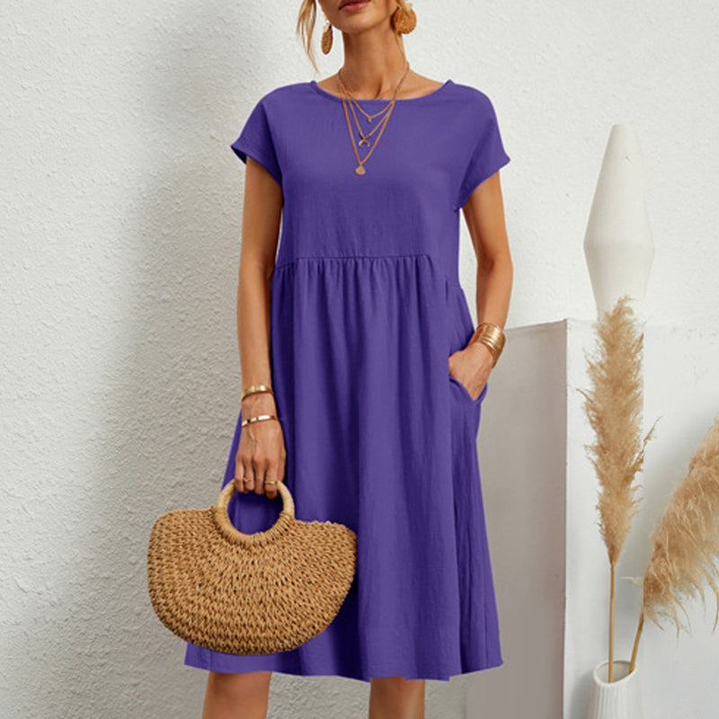Classic round neck midi dress for women, crafted from soft cotton, ideal for casual outings.