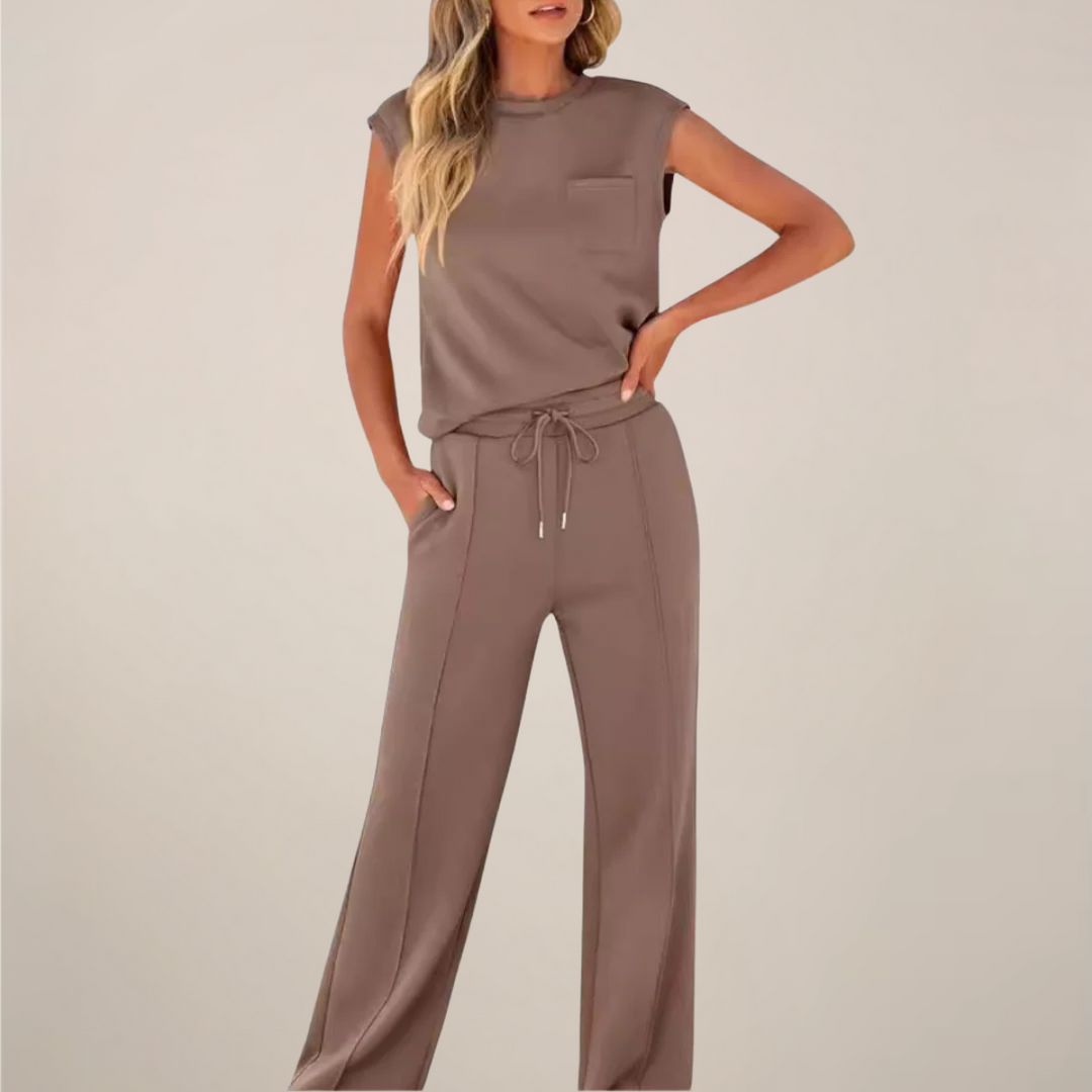 Spring fashion women's outfit: relaxed fit drawstring pants and a casual long-sleeve top.