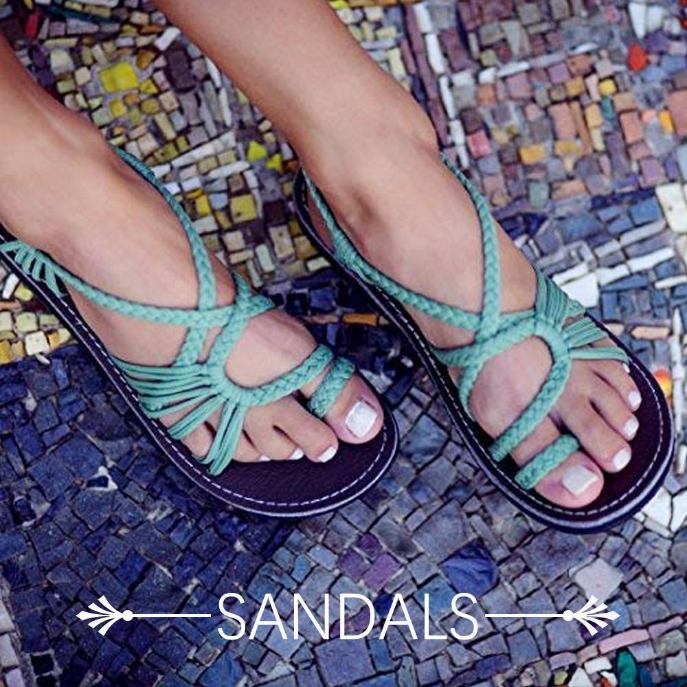 Boho-style women's flat sandals featuring an intricate palm leaf pattern, ideal for warm weather.