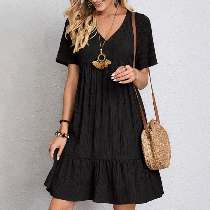 A collection of women's casual flowy mini dresses in various summer colors, comfortable and A-line.