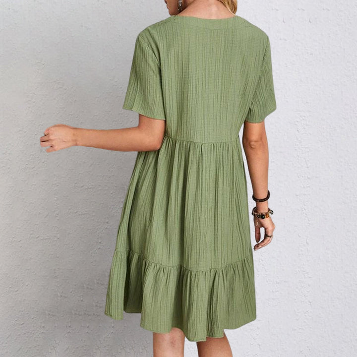 Stylish women's casual mini dress, A-line cut with a flowy silhouette, great for everyday summer wear.