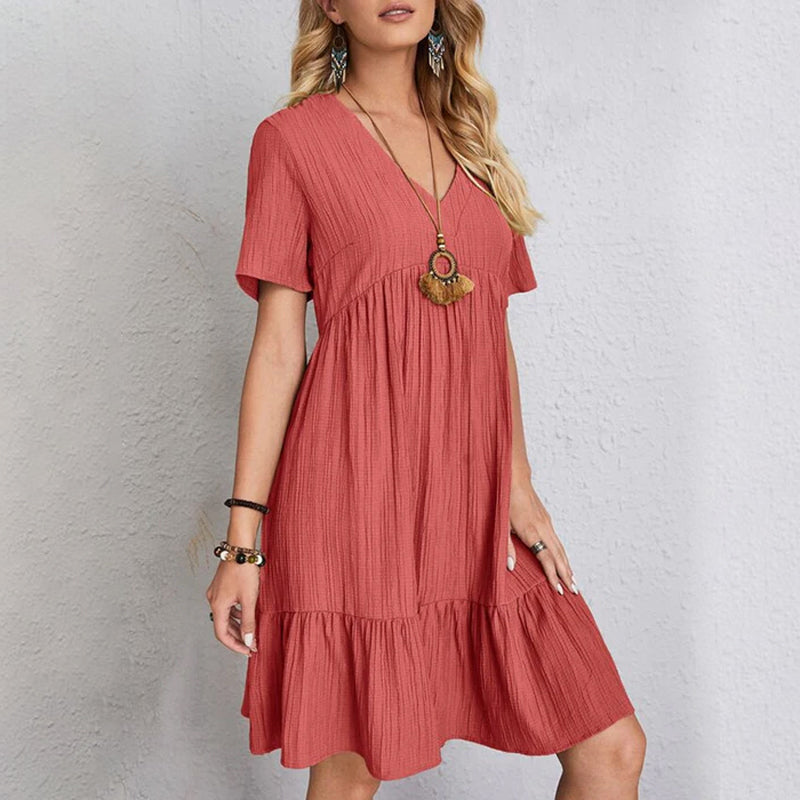 Close-up of the fabric texture of a comfortable flowy mini dress made from soft polyester for women.
