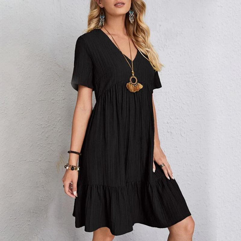 Model wearing a women's casual flowy mini dress, highlighting its A-line shape and comfortable fit.