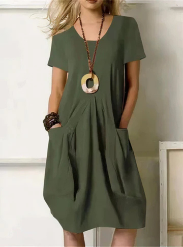 Stylish short sleeve midi dress for women, featuring gathered waist and convenient pockets. Great for casual everyday wear.