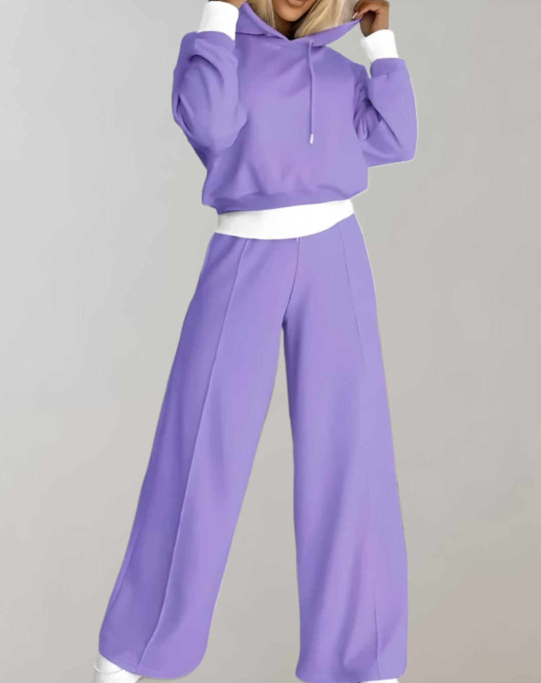 Cozy women's two-piece athleisure set featuring a hooded sweatshirt and matching joggers