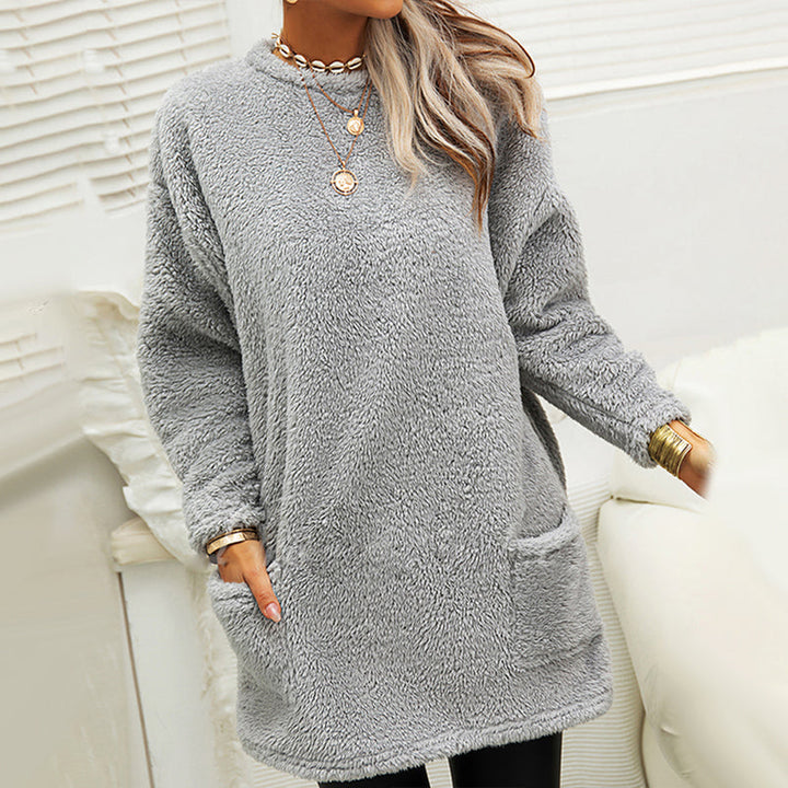 Close-up of the soft fabric of a women's black long sleeve t-shirt dress, showcasing the texture