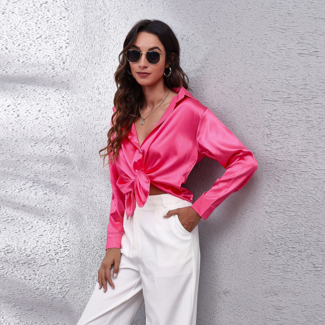 Fashionable women's long sleeve satin blouse in a relaxed, elegant workwear design