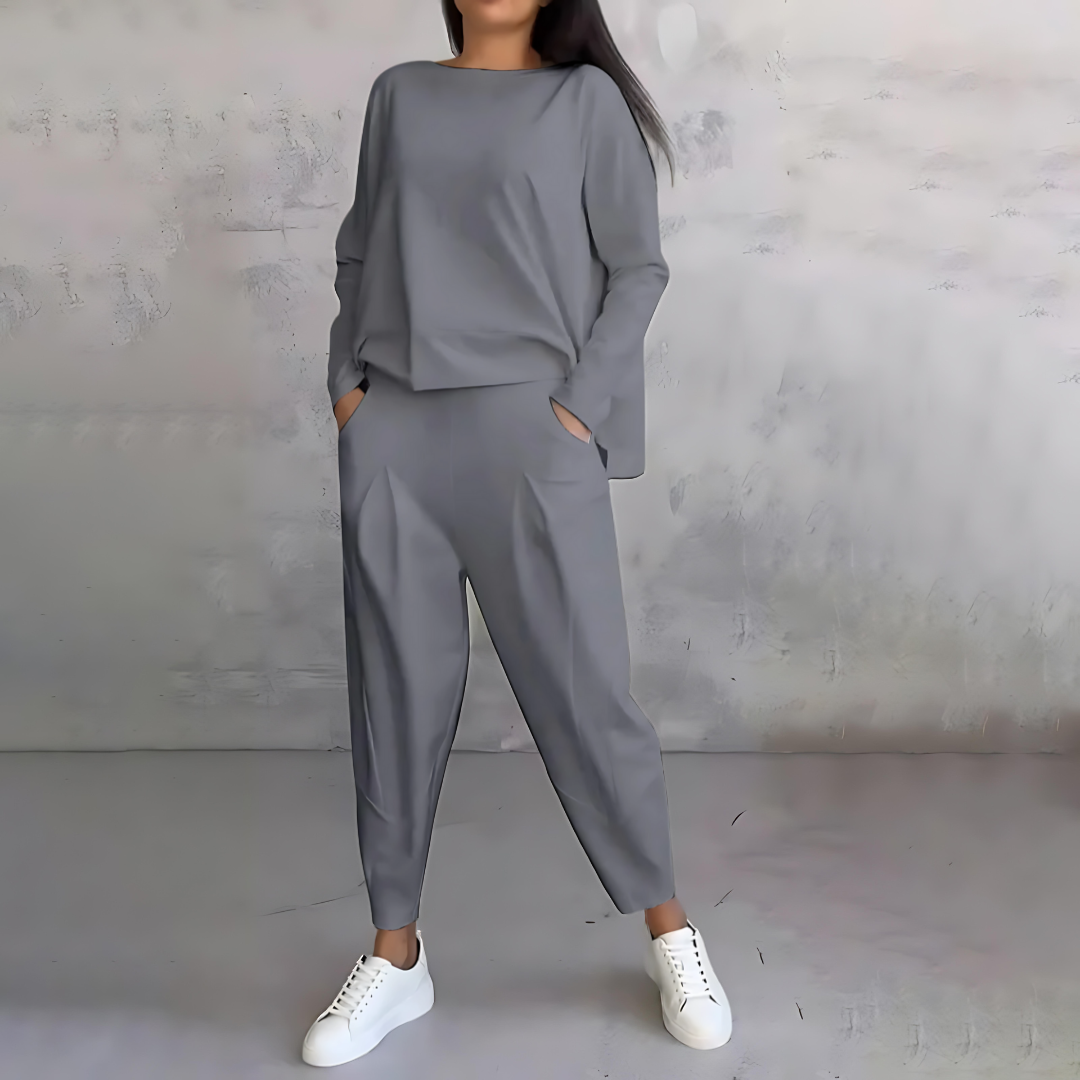 Two-piece women's casual set featuring a long-sleeve loose-fit top and matching tapered pants.
