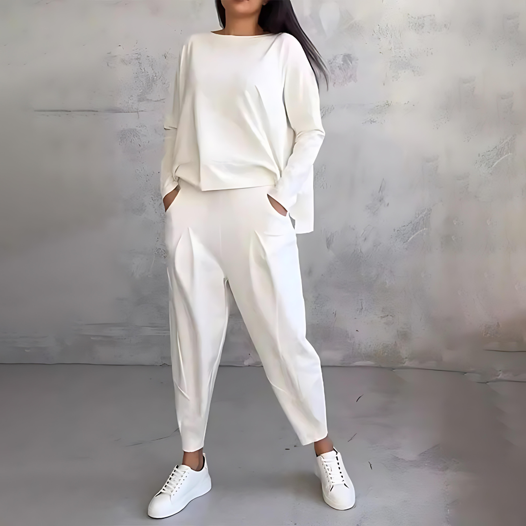 Full shot of a model wearing a women's comfortable loose-fit top and pants set, ideal for casual wear.