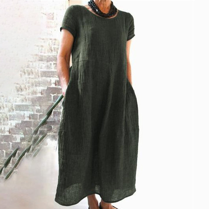 Effortlessly stylish women's loose fit T-shirt dress, solid color, perfect for casual spring days.
