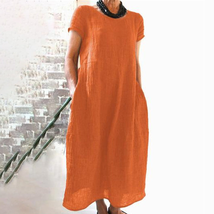 Casual women's cotton dress, solid color, loose fit for easy wearing in warm weather.