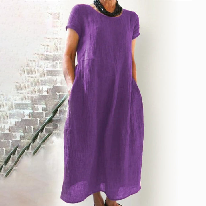 Simple yet chic women's T-shirt dress, solid color, loose fit, great for relaxed occasions.