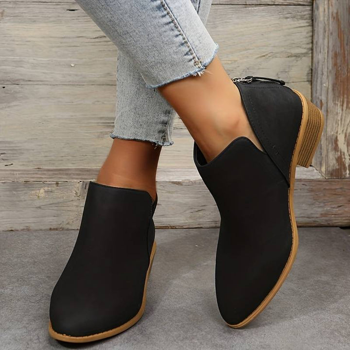 Fashionable women's casual boots with a low heel and slip-on design for daily comfort