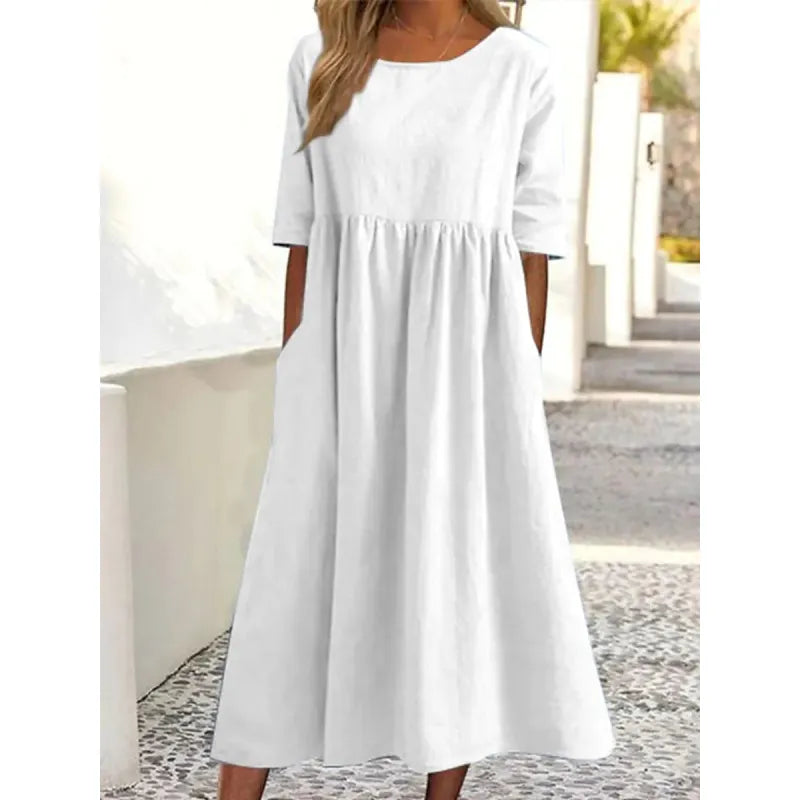 Comfortable women's relaxed-fit maxi dress, featuring half-sleeves and handy pockets for daily wear.