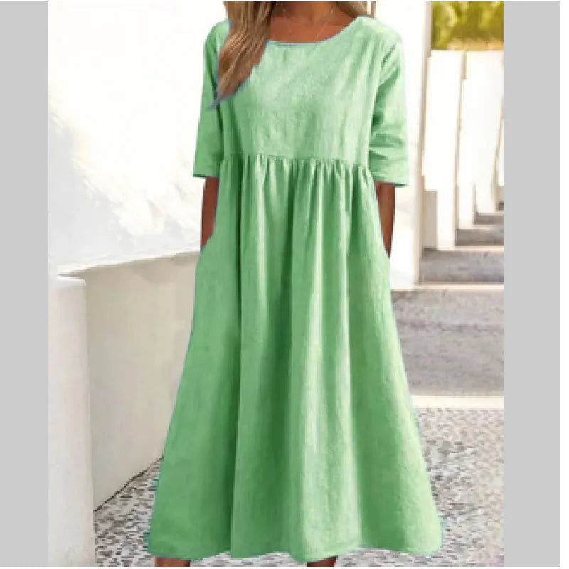 Effortless women's pocket maxi dress with half-sleeves, ideal for comfortable spring and summer wear.