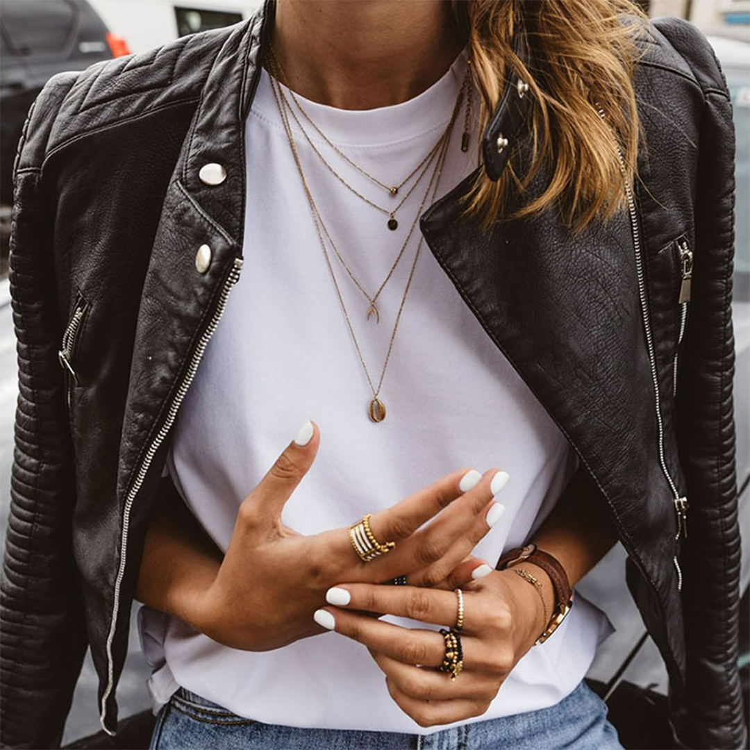 Fashionable women's moto jacket with zipper details, ideal for casual wear and a trendy fall outfit.