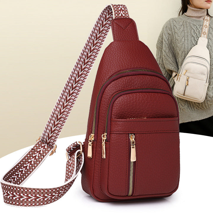 Detail of the zipper closure on a women's casual black PU leather fanny pack