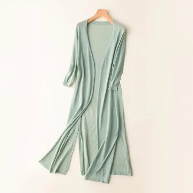 Elegant women's longline cardigan, relaxed fit for casual wear, perfect all-season layering piece.