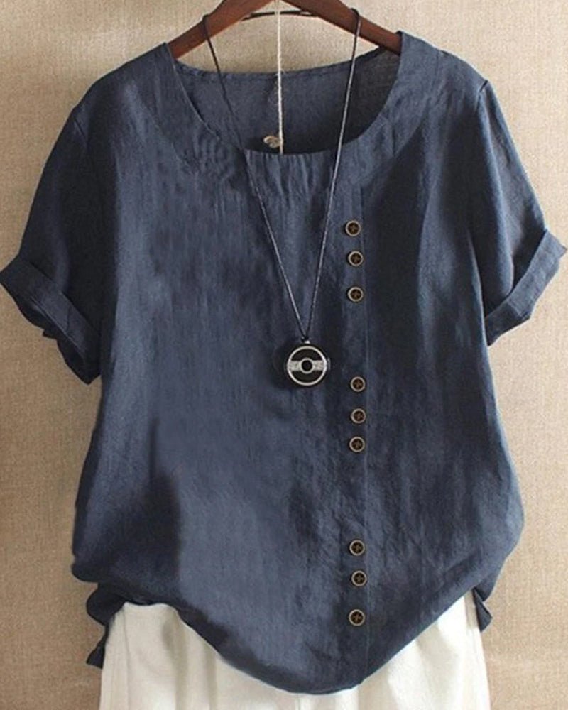 Versatile women's short sleeve button-front top for casual spring and summer style. Features a comfortable relaxed fit.