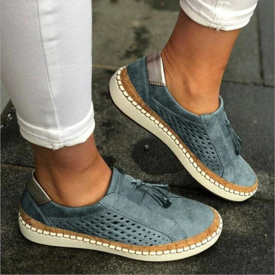 Tan women's slip-on loafers showing the flexible sole, perfect for comfortable spring fashion.