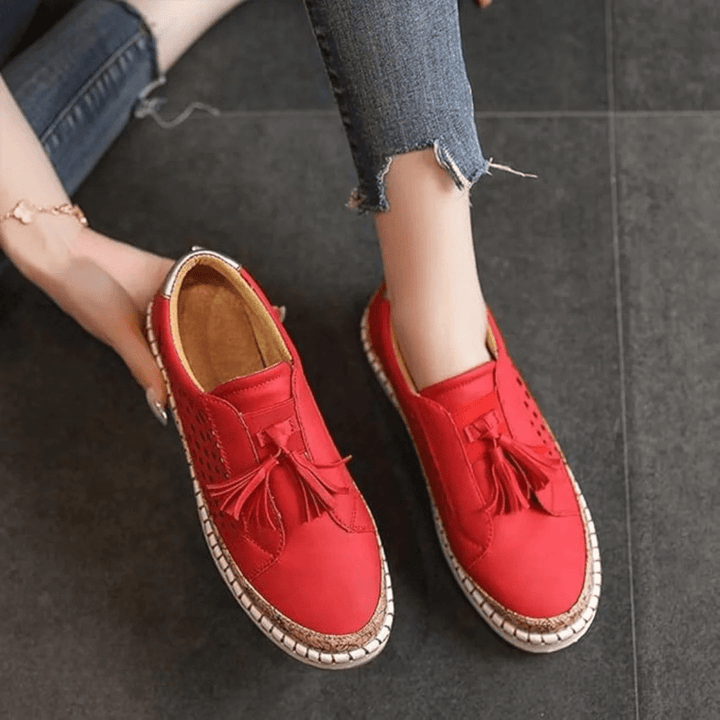 Close-up of the detailed stitching on women's casual slip-on loafers, highlighting quality.