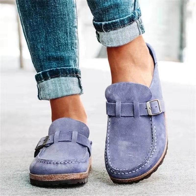 Side view of a casual women's slip-on loafer with an elegant buckle, versatile footwear.