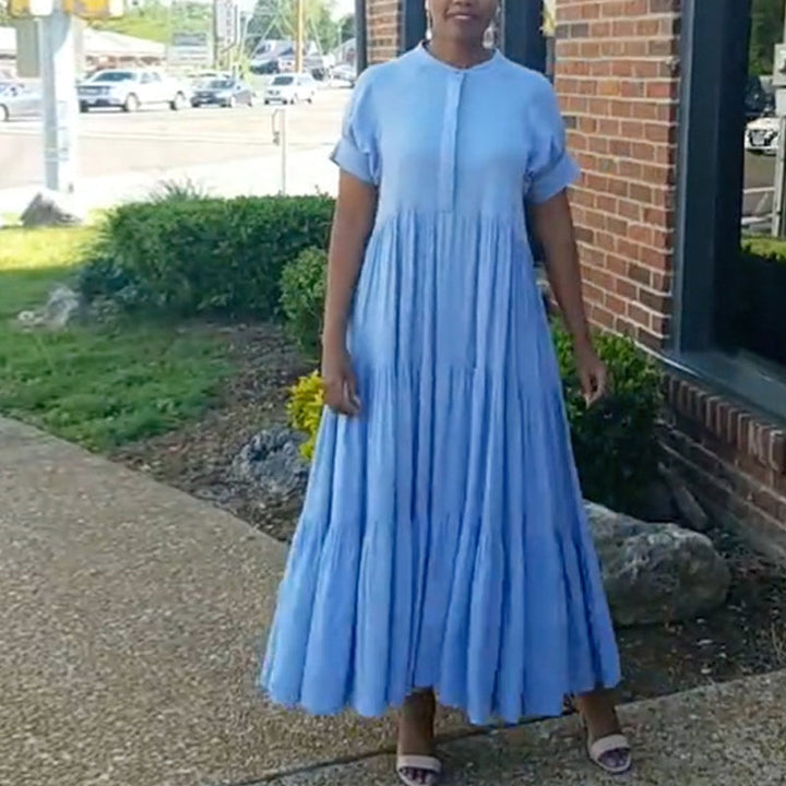 Model wearing a comfortable women's spandex tiered midi dress, showcasing its loose fit and style