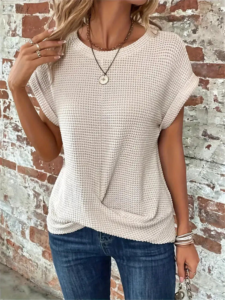 Relaxed fit women's tee with a unique twist front detail. Ideal casual comfort for modern women.
