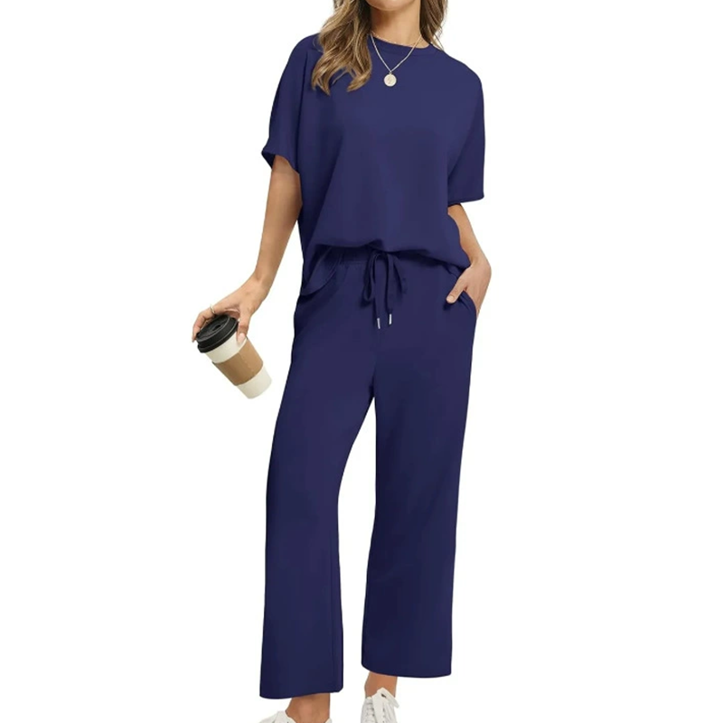 Stylish women's lounge set: two-piece casual wear with drawstring wide-leg pants, relaxed fit top, & functional pockets.