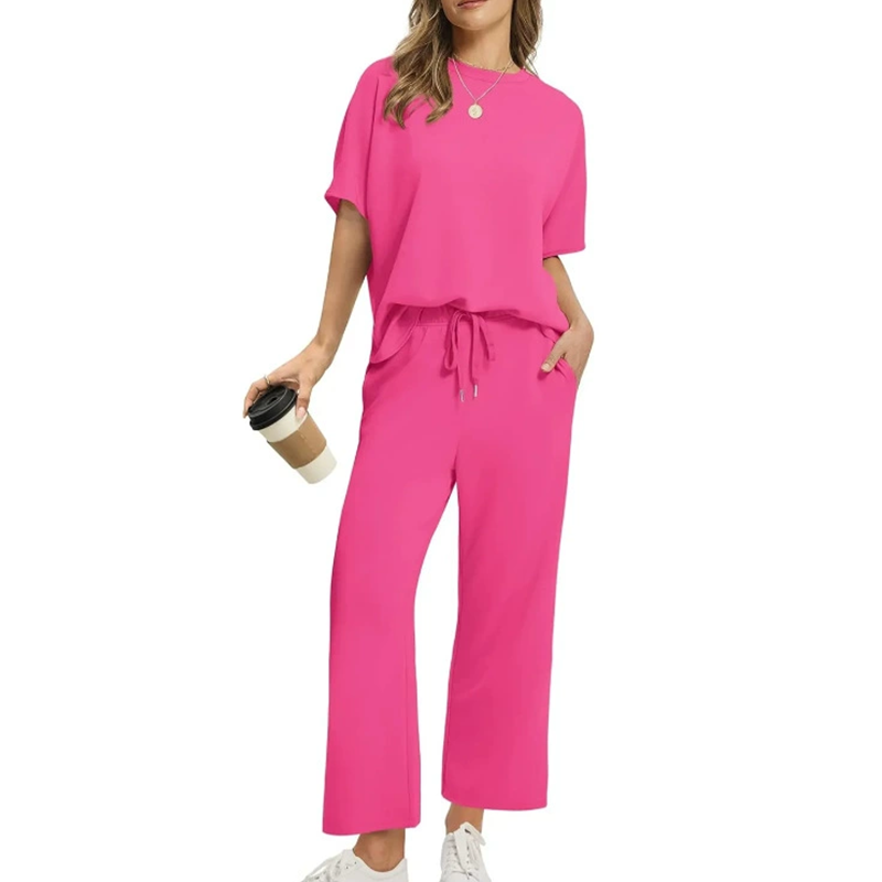 Soft women's casual two-piece lounge set with pockets, designed for comfort and relaxed wear, wide-leg pants.