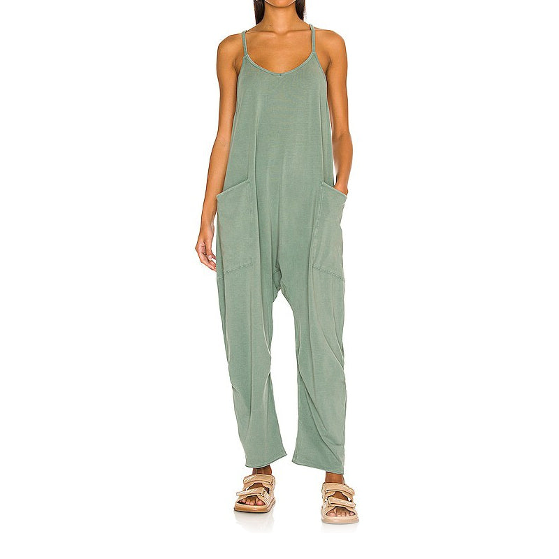 Side profile of a women's loose fit jumpsuit, showing the relaxed tailoring and overall comfortable aesthetic.