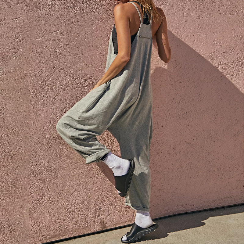 Full-body shot of a comfortable women's wide-leg jumpsuit, featuring a flattering V-neck and relaxed silhouette.
