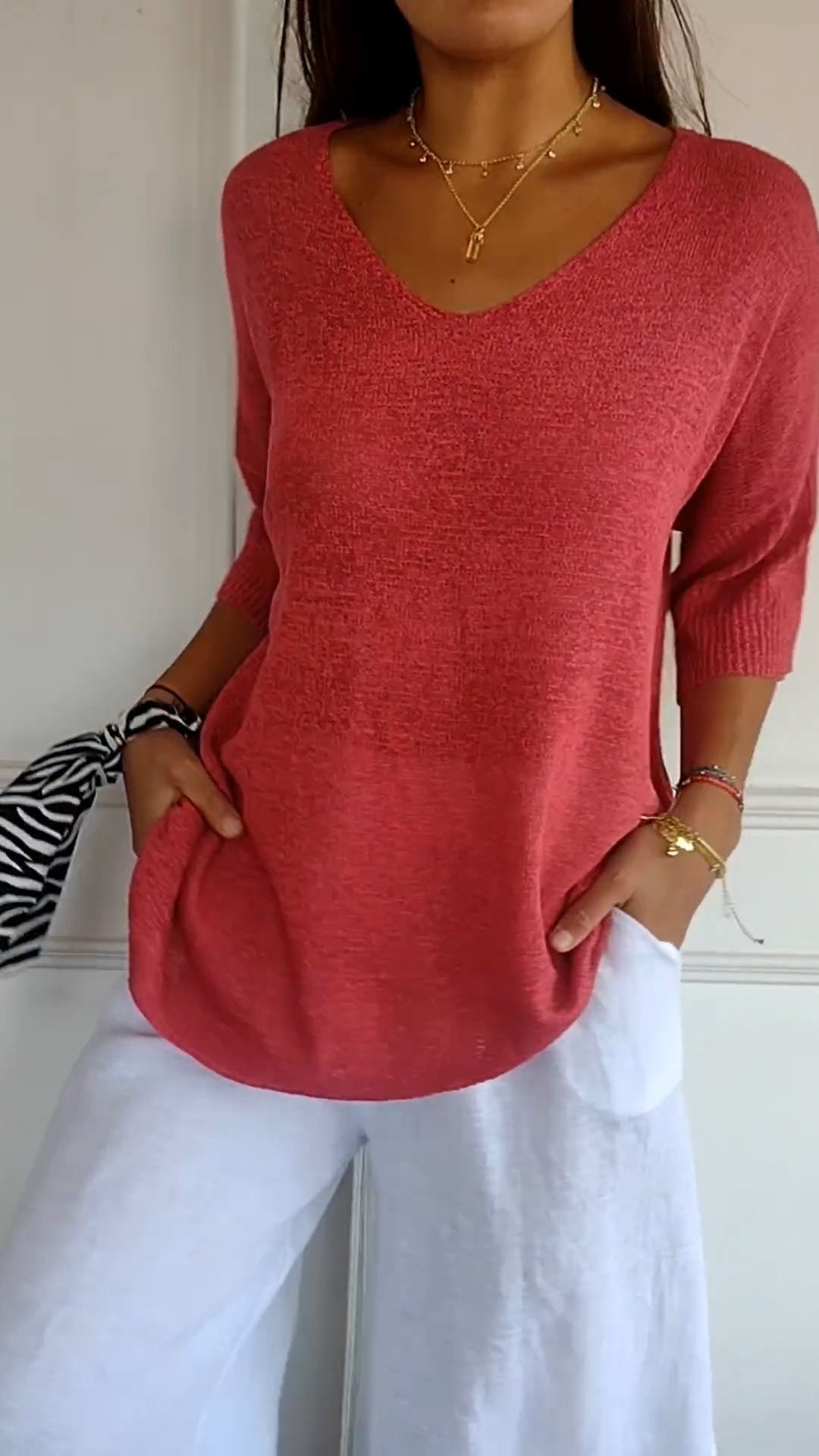 Women's casual V-neck pullover top in a comfortable loose fit, perfect for everyday wear.
