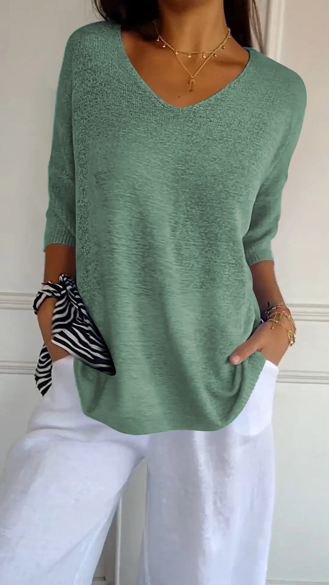 Chic women's V-neck top, a versatile loose-fit pullover for comfortable spring & fall fashion.