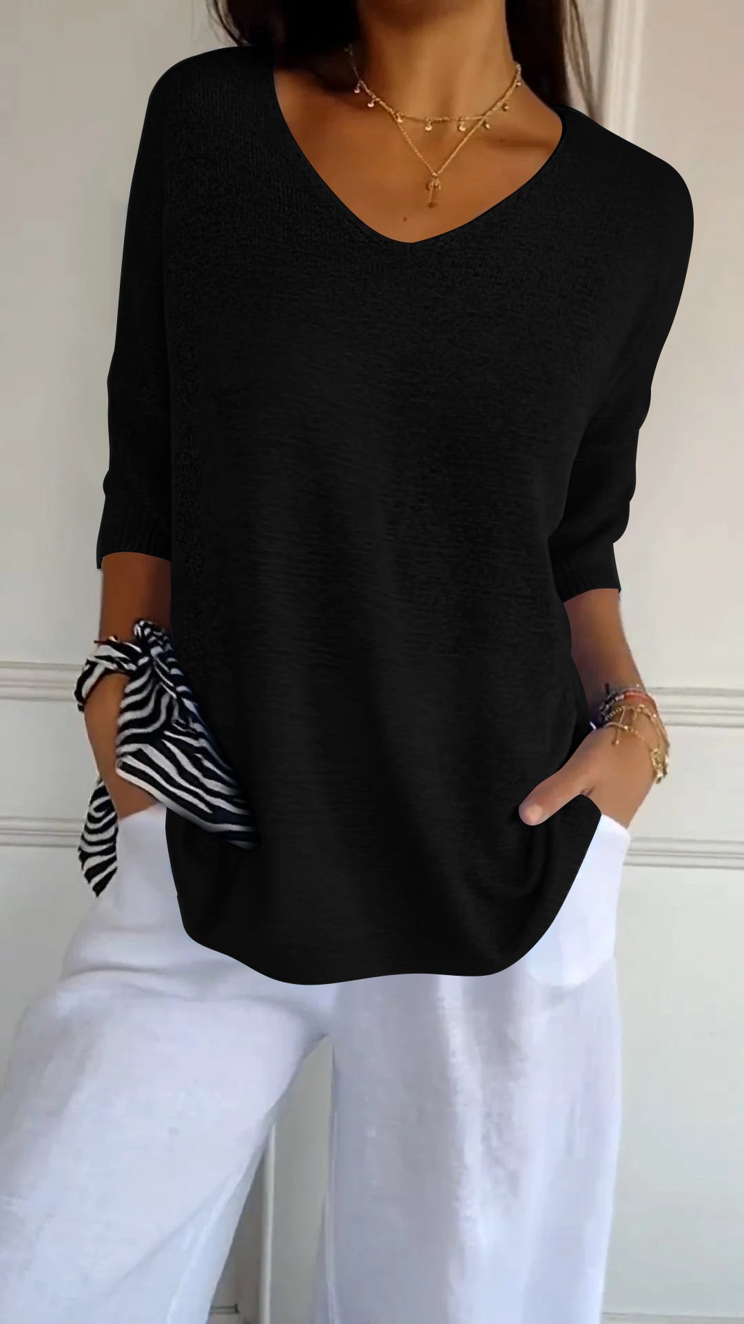Soft, comfortable women's V-neck pullover top, a casual loose-fit design for daily wear.