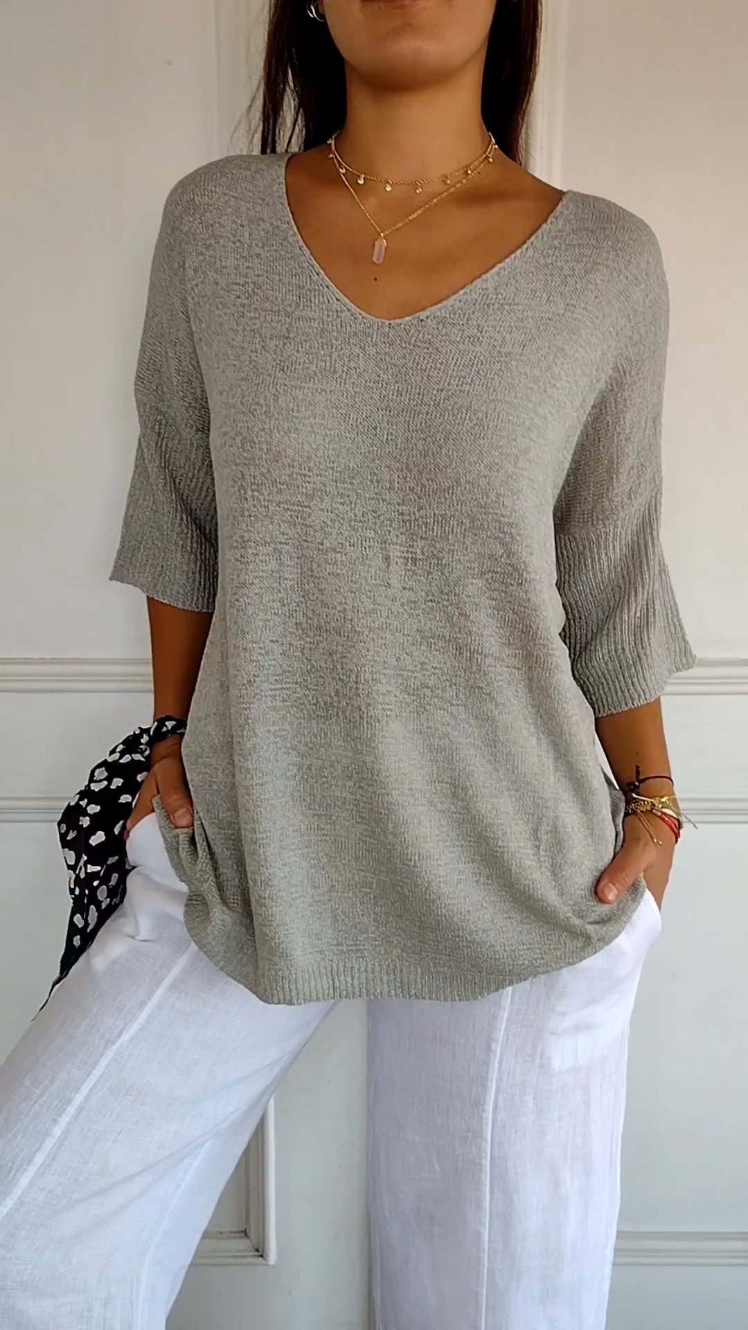Comfortable loose-fit women's V-neck pullover top, ideal for casual everyday spring and fall fashion.