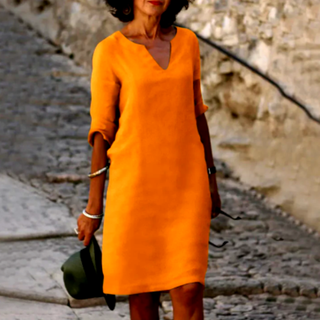 Breathable women's summer shift dress, V-neck, half sleeves, relaxed fit for warm days.
