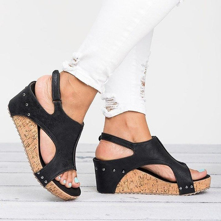 Side view of women's wedge heel sandals, highlighting the comfortable sole design