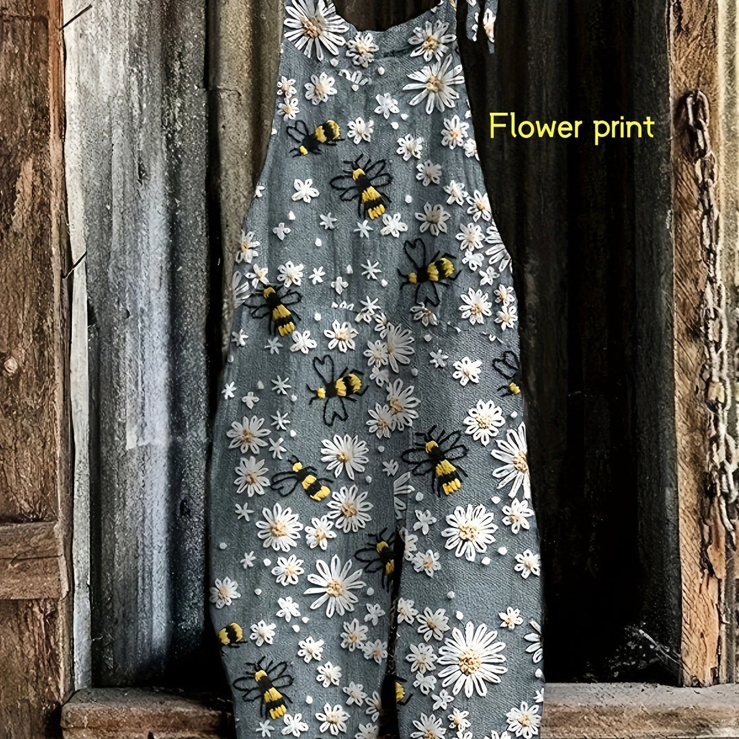 Women's comfortable cropped jumpsuit with daisy & bee print, showing off the tie-shoulders. Casual garden style.