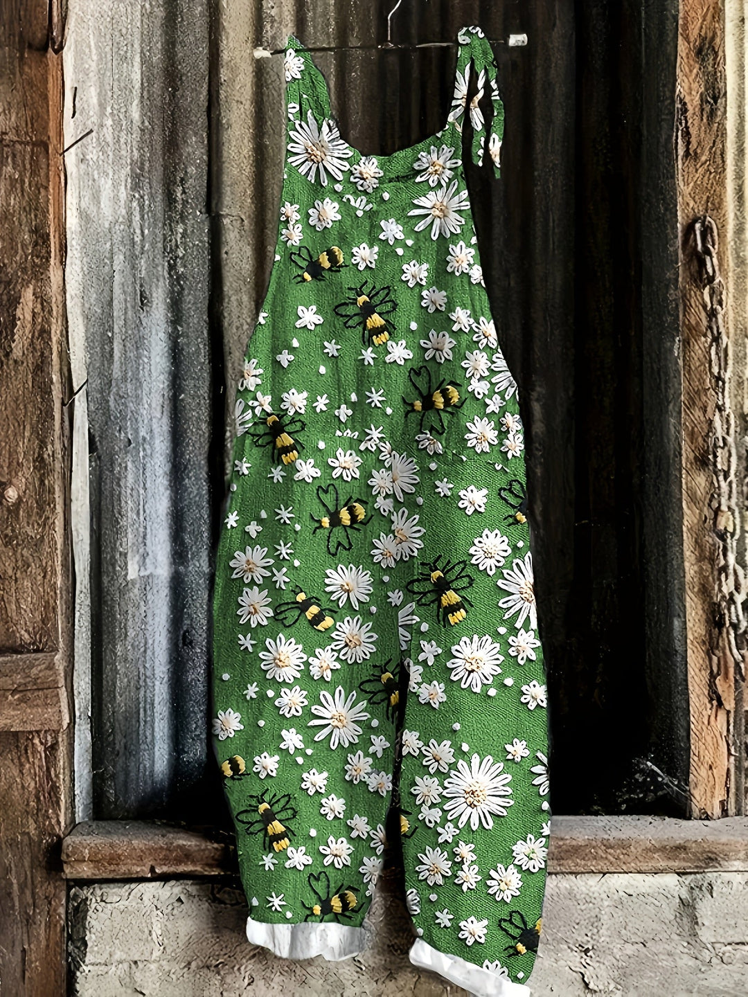 Soft women's casual jumpsuit, daisy bee print, wide-leg, tie-shoulder, with pockets. Comfortable summer fashion.