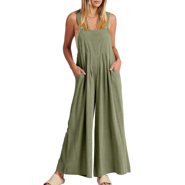 Full-length shot of a woman wearing a black wide leg sleeveless jumpsuit, casual fashion.