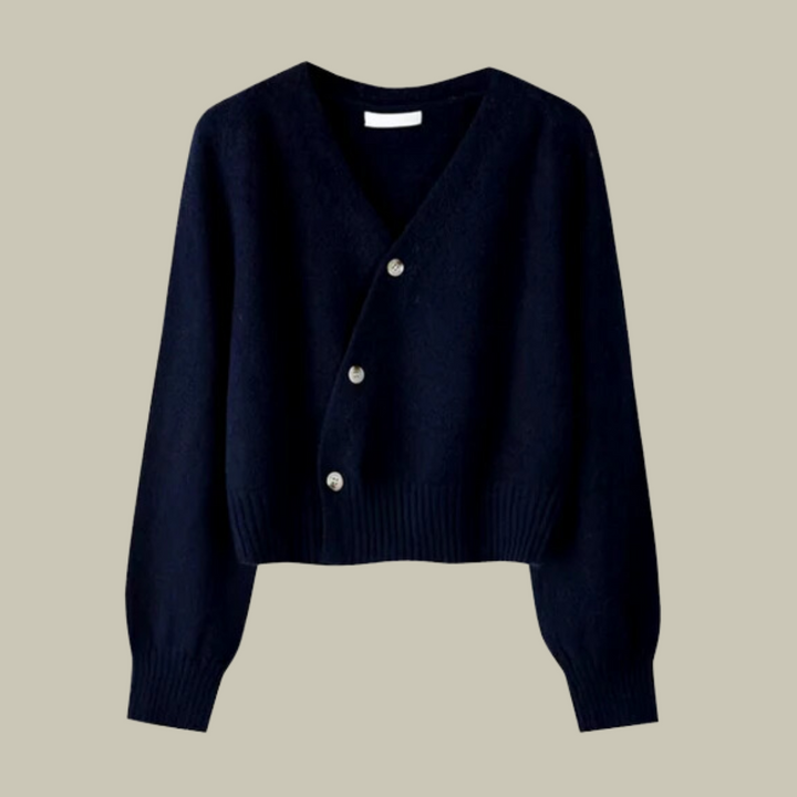 Close-up of the cross button detail on a women's v-neck merino wool blend sweater.