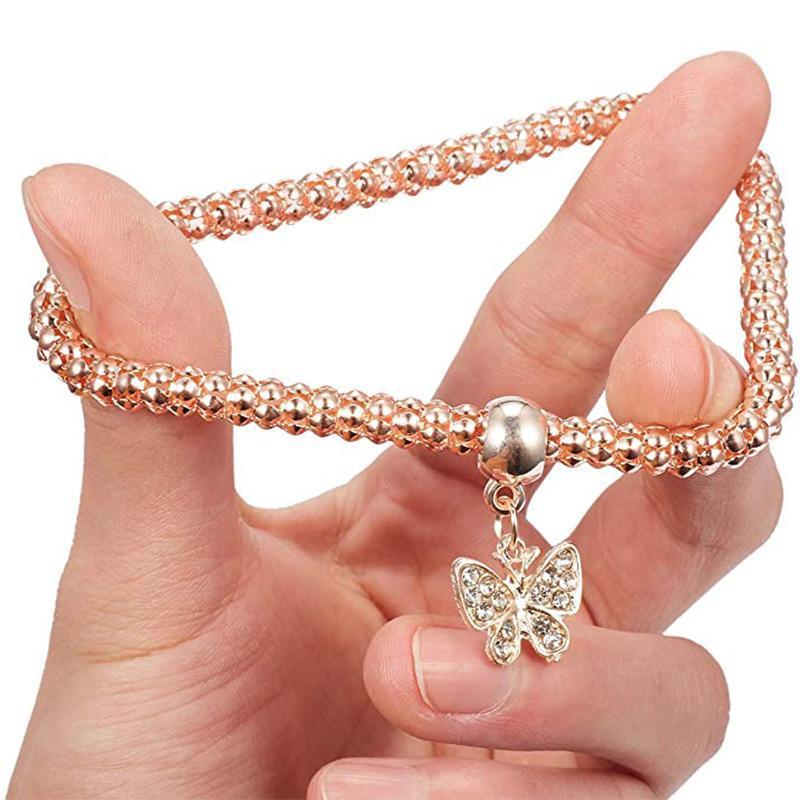 Three-piece women's popcorn bracelet set showcasing various rhinestone charms, ideal for any occasion