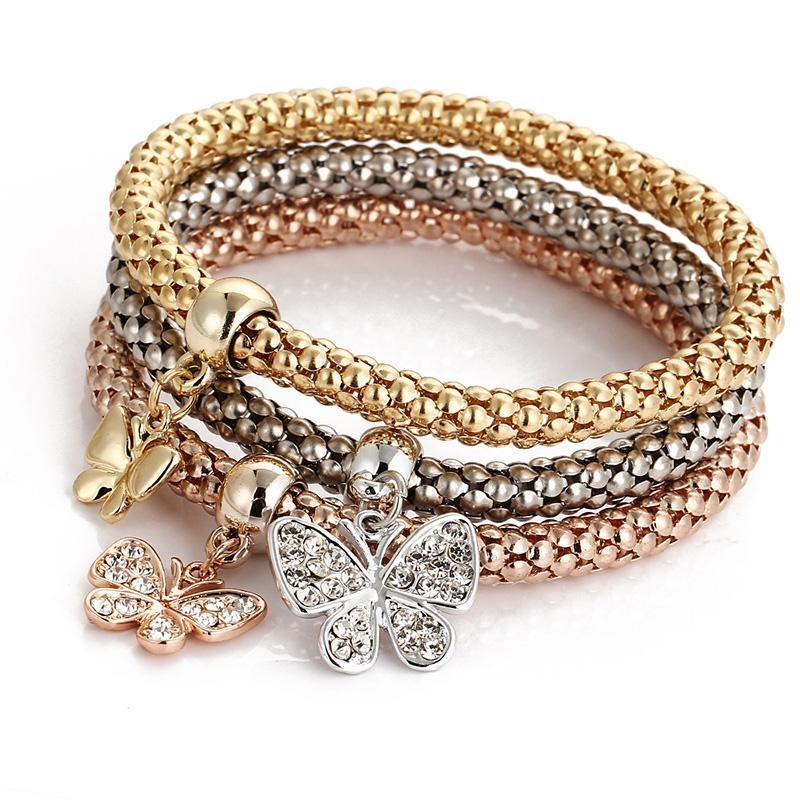 Elegant women's rhinestone and charm bracelet set on a white background, highlighting its sparkle