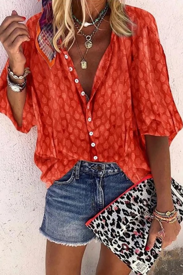 Textured shot of the breathable, airy fabric of the women's chic button blouse, great for warm weather.
