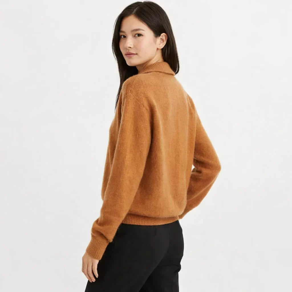 Cozy women's knit cardigan with stylish asymmetrical buttons. Ideal for versatile fall fashion.