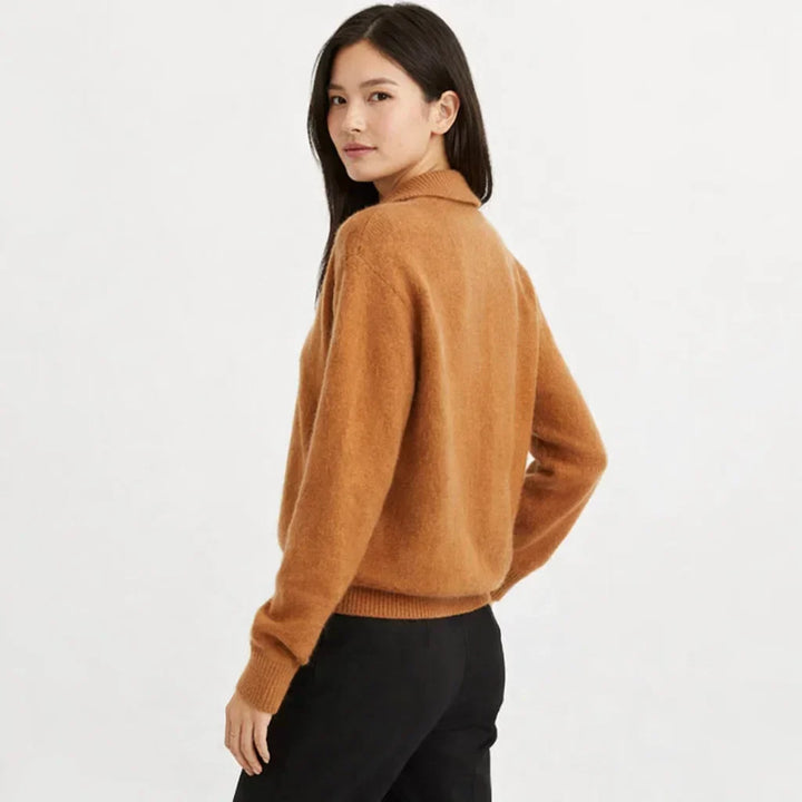 Cozy women's knit cardigan with stylish asymmetrical buttons. Ideal for versatile fall fashion.