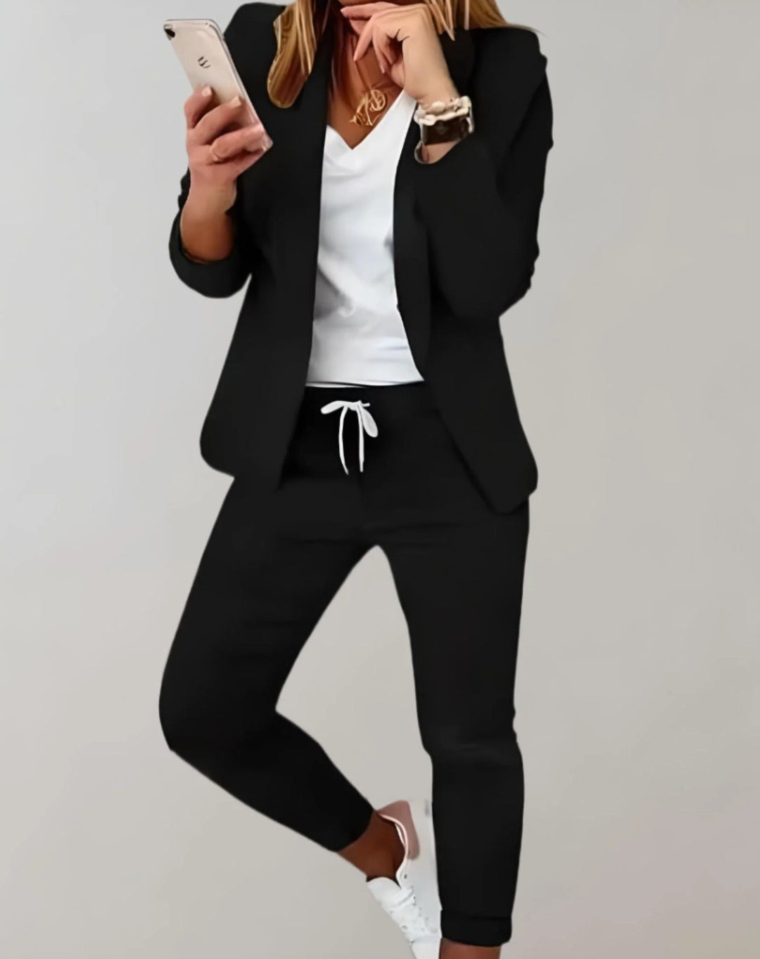 Modern women's chic two-piece blazer and trousers set, offering a polished and comfortable look.