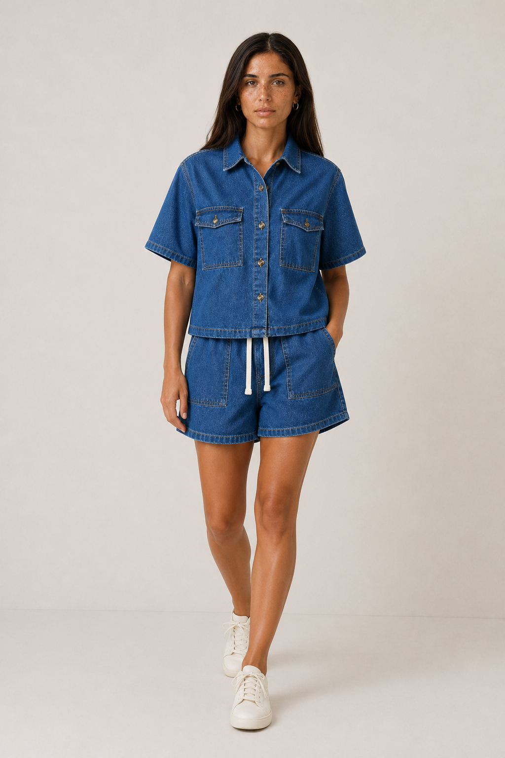 Women's chic denim short set. Blue two-piece casual outfit with jacket & shorts for summer & spring fashion.